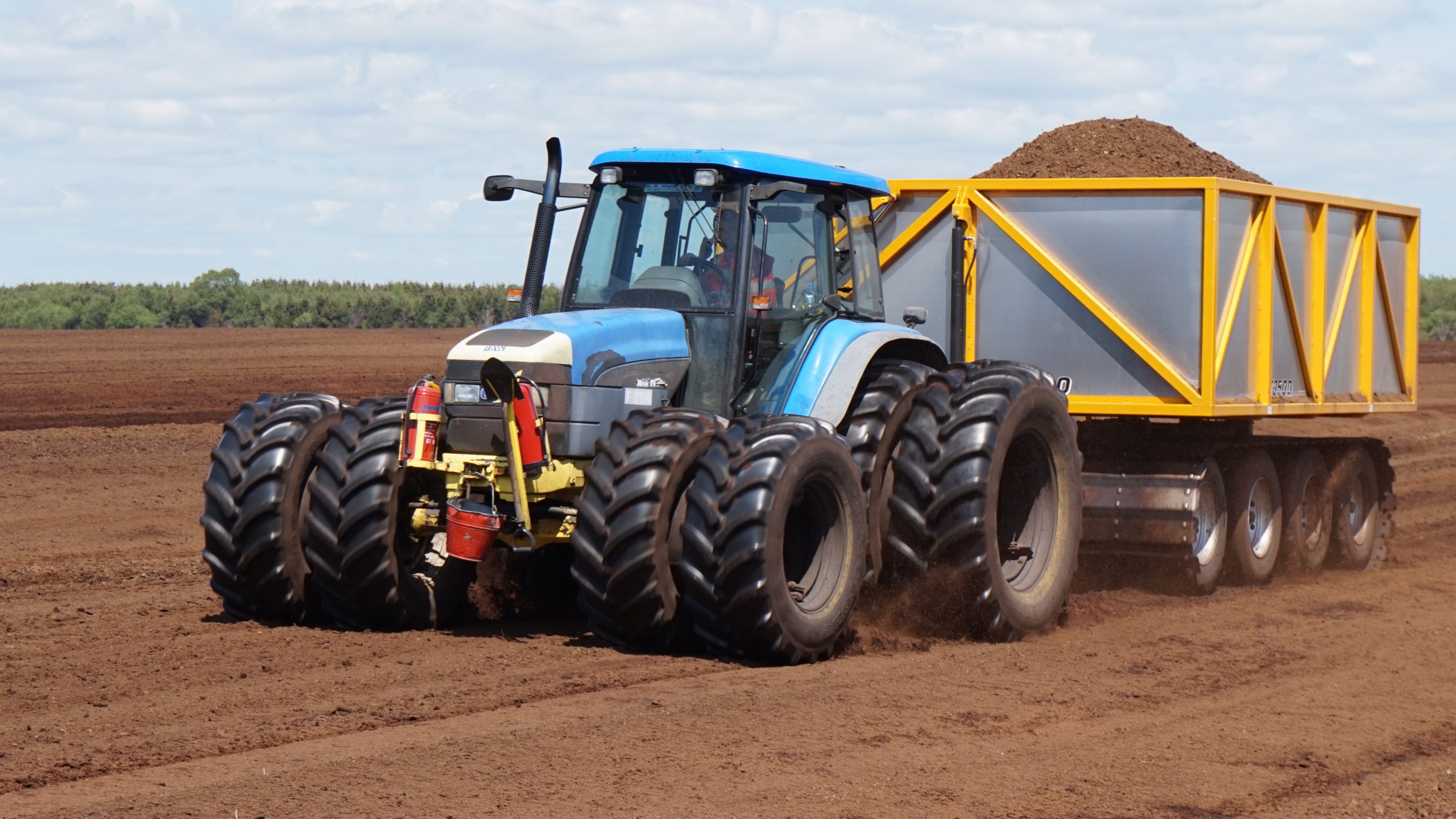 tractor peat harvesting extraction